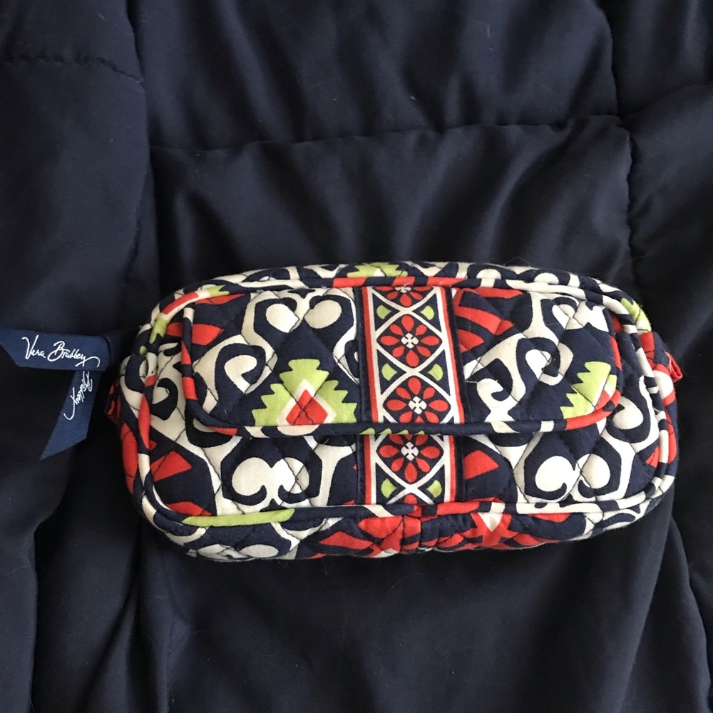 Cosmetic bag magnetic pocket and mirror